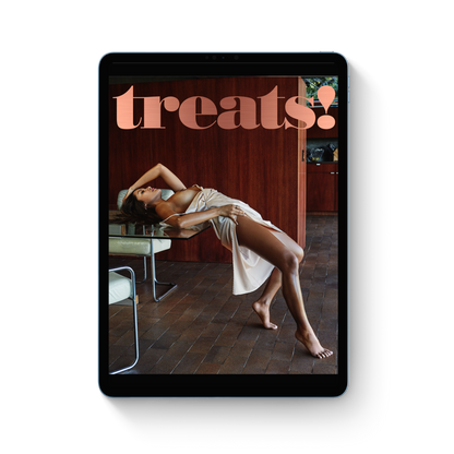 Tablet displaying a magazine cover with a woman lying on a chair and 'treats!' text.